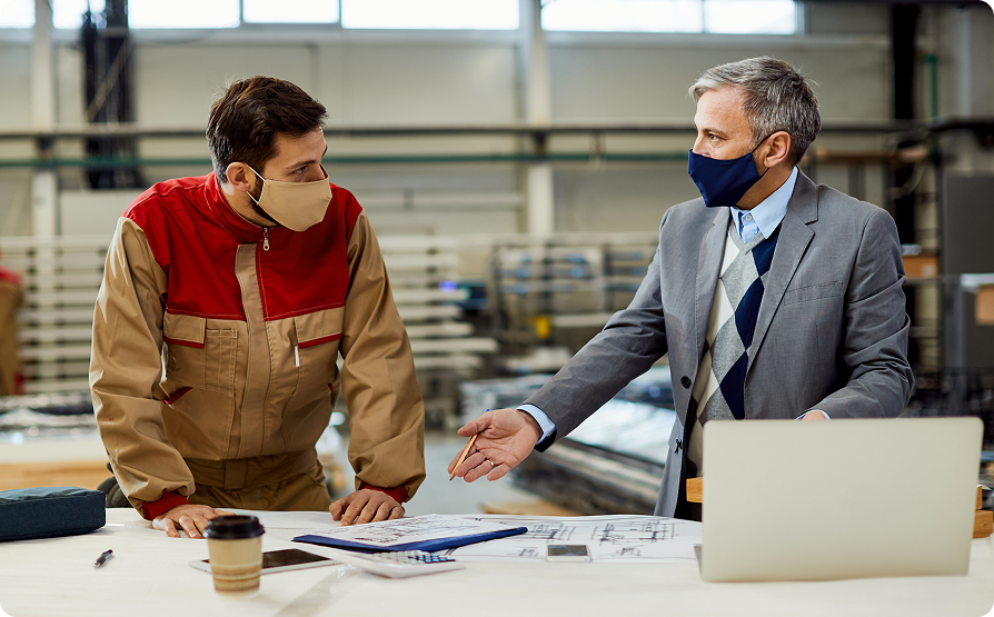 Project manager talking to carpenter